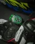 Černé pánské hodinky Bomberg s gumovým páskem RACING 4.4 Green 45MM